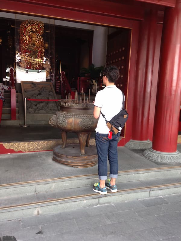 Praying friend on the temple